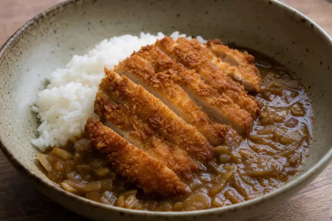 Crispy panko-breaded chicken katsu over rice with rich curry sauce.