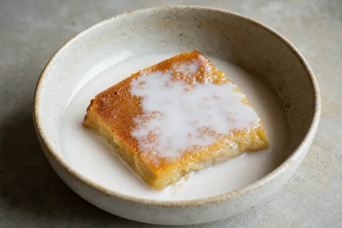 Creamy coconut custard layered with coconut cream, garnished and plated beautifully.