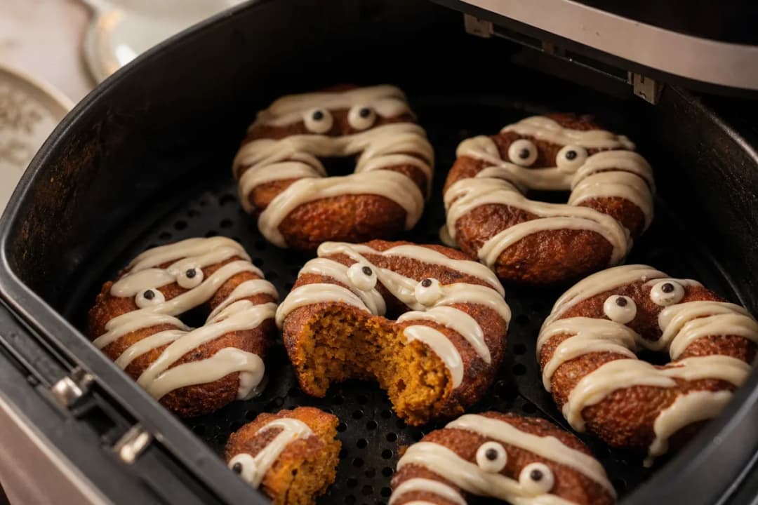 Spooky Air Fryer Pumpkin Spice Mummy Doughnuts with Creamy Drizzle