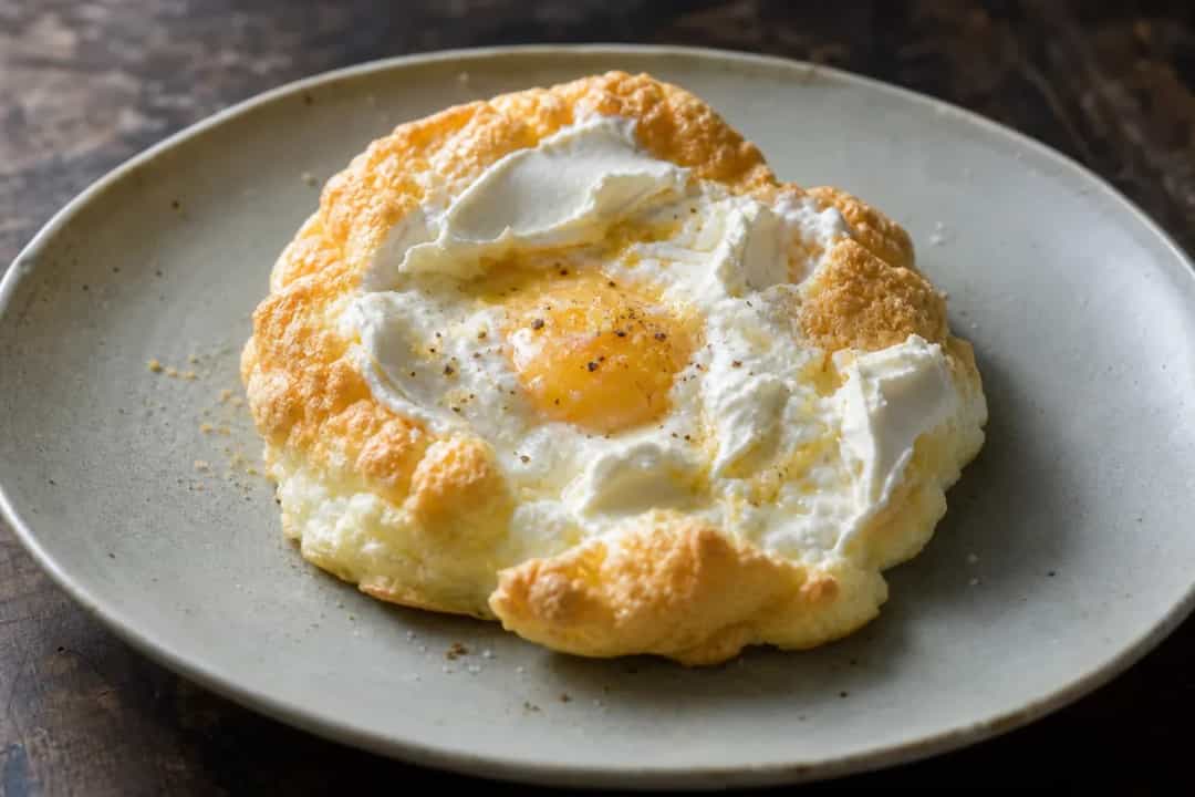 Light and airy cloud bread with a golden crust, served on a plate.